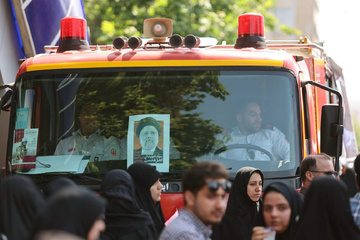 روایت تصویری عکاس سازمان زندان‌ها از آئین تشییع «شهدای خدمت» در شهر تهران