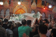 پرچم متبرک ضریح امام علی علیه‌السلام در بازداشتگاه اوین
